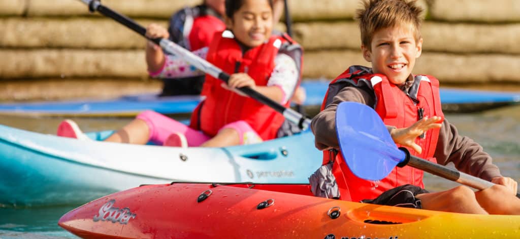 Find a paddling centre. Kids at a paddling centre.