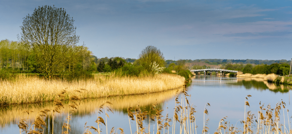 River Weaver in West Cheshire on a summer's day looking across to the bridge