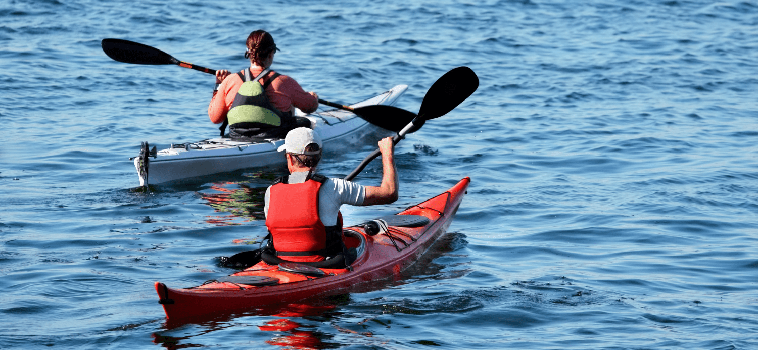 Male and female kayaking together