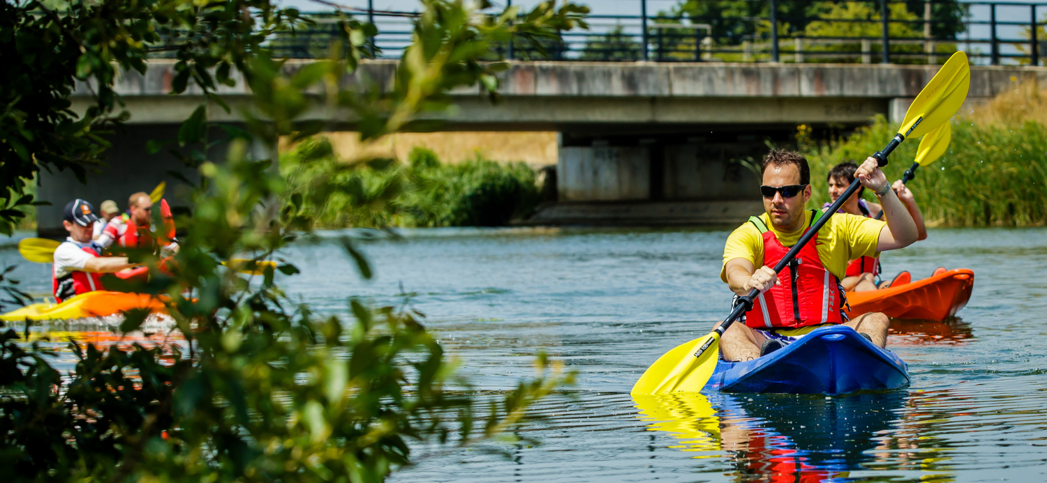 Man learning how to kayak in summer