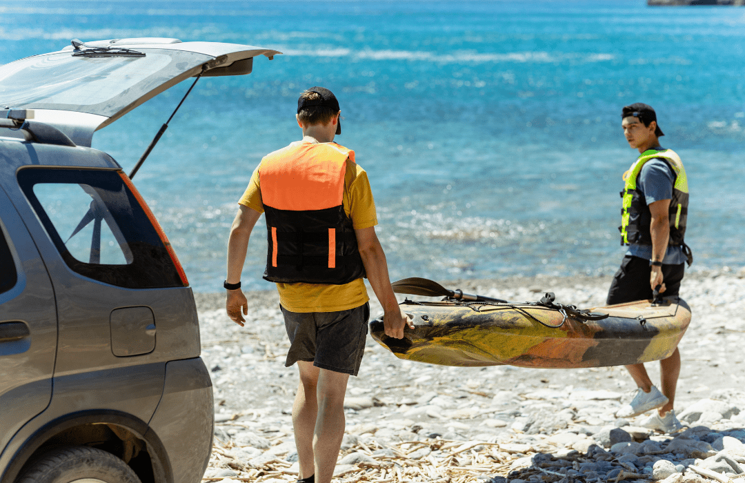 carrying kayak offshore away 