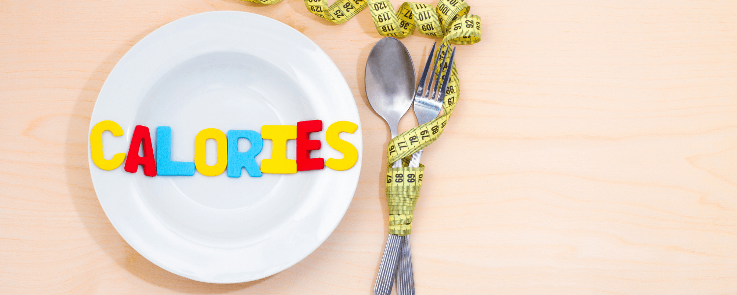 a plate with the word calories on it next to cutlery