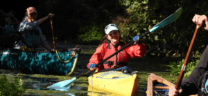Anastasia Mylona kayaking with a large smile
