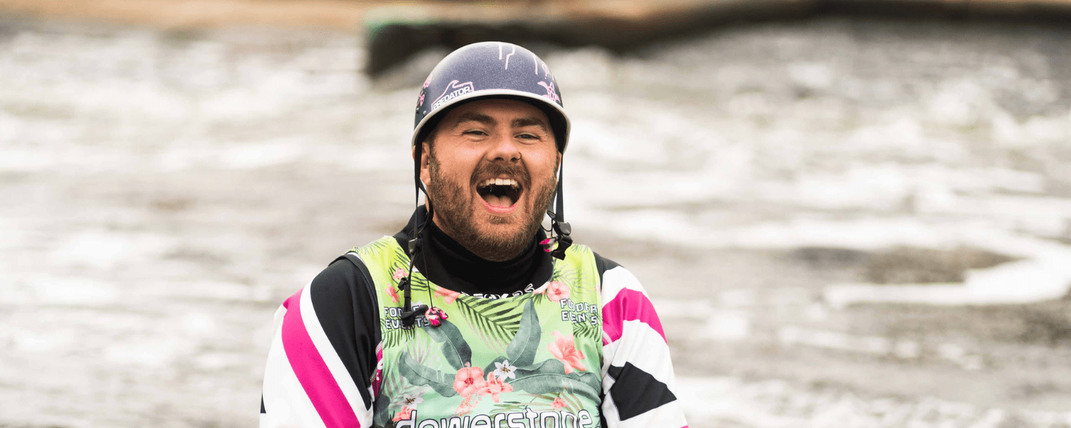 a person in kayaking kit with a big smile