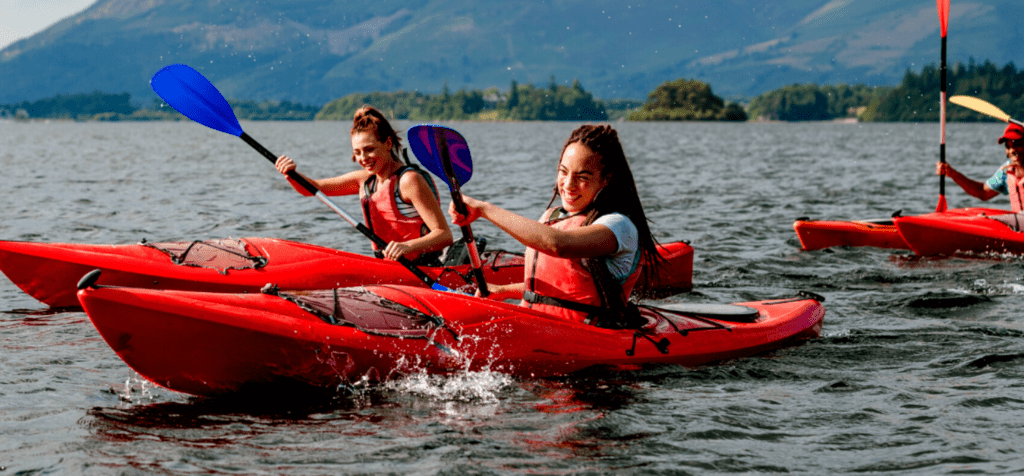 a group of people enjoyign kayaking