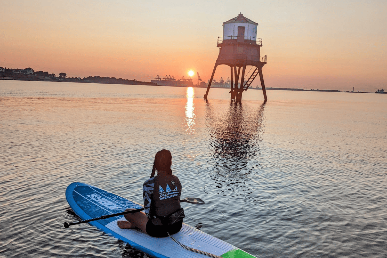 Jess sat on a board at dovercourt