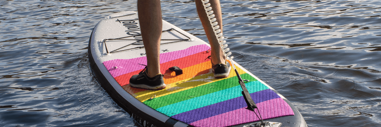 feet firmly on a paddleboard